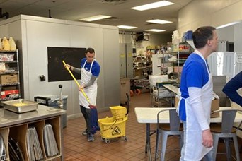 Mopping up after serving lunch at The Community Table