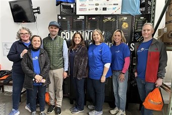 Carrie with the Providence branch at FeedRI participating in the National Day of Service, 11/13/2025