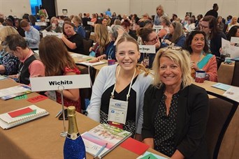 Representing Executive Women International of Wichita at a conference in Houston