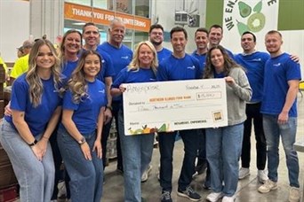 Volunteering at Northern Illinois Food Bank & presenting a check from Ameriprise for $15,000 