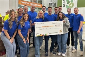 Volunteering at Northern Illinois Food Bank & presenting a check from Ameriprise for $15,000 