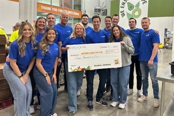 Volunteering at Northern Illinois Food Bank & presenting a check from Ameriprise for $15,000 