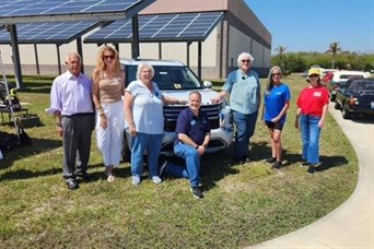Helping Seniors of Brevard board members and volunteers at the American Muscle Car Museum
