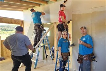 Bill, Cindy & Parker doing dry wall while on their yearly mission trip to Ensenada, Mexico. 