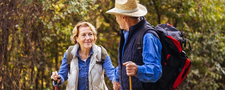 Older adults hiking in the woods