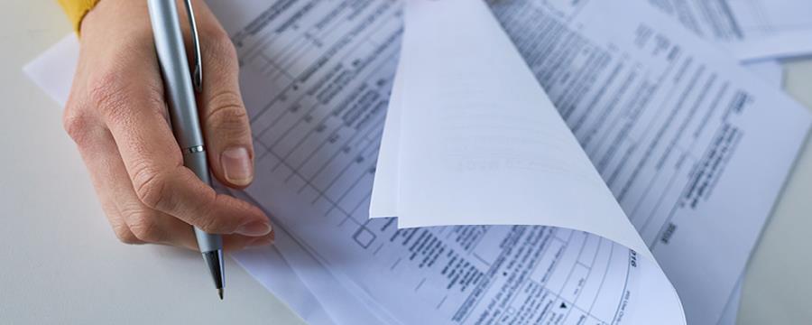 A person holding a piece of paper