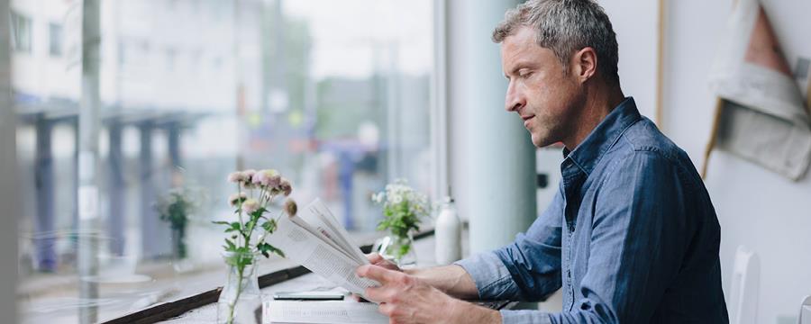 Businessman reading newspaper at caf&amp;amp;amp;amp;amp;amp;amp;amp;amp;amp;amp;amp;amp;amp;amp;amp;amp;amp;amp;amp;amp;amp;amp;amp;amp;amp;amp;eacute;.