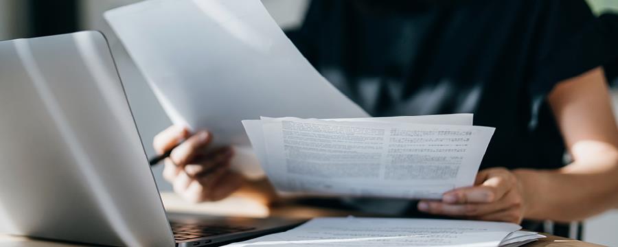 Woman reviewing finances at home.