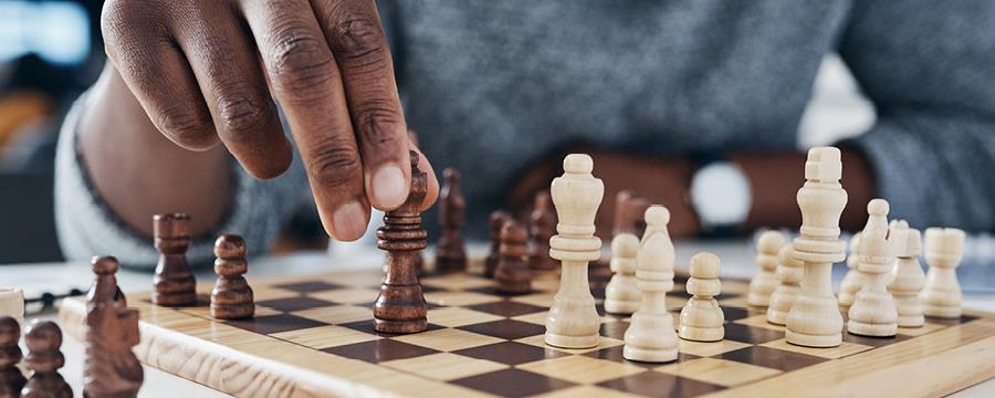Chess game in progress at a low angle