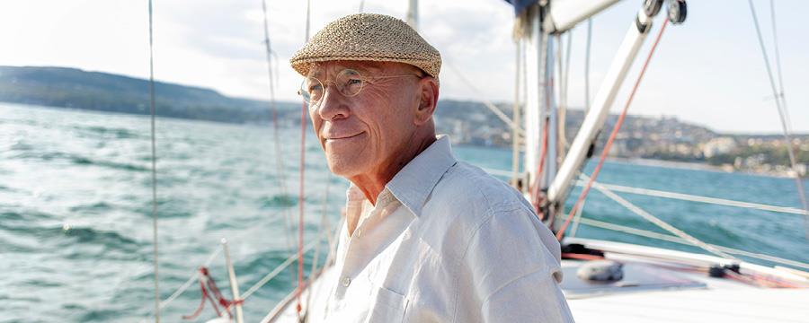 Retired man on a sailboat.