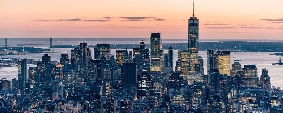 A view of the Manhattan skyline at dusk.