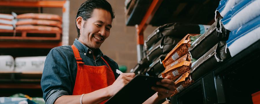 A small business owner reviewing his inventory.