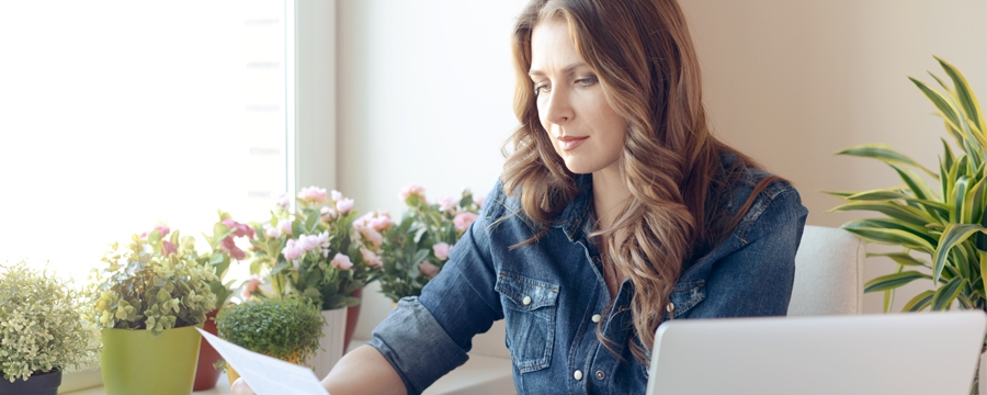 Woman reviewing financial documents