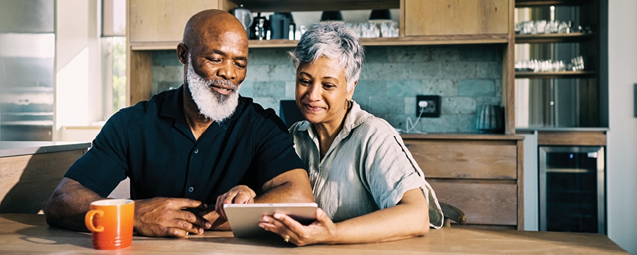 Couple reviewing their Medicare options on their tablet