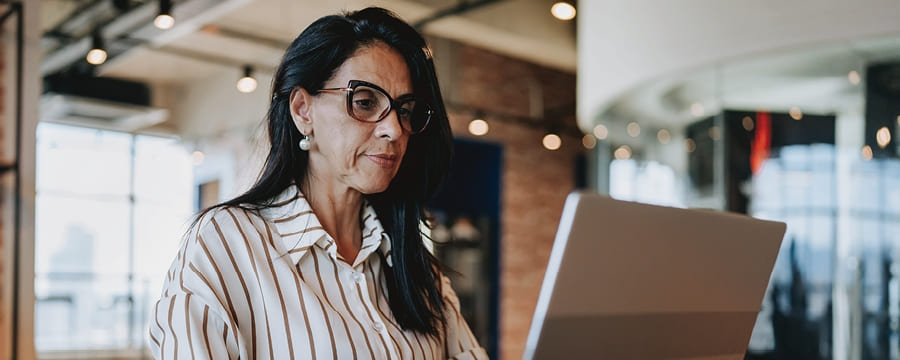 Woman looking at laptop