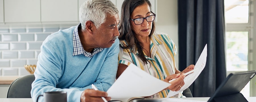 Couple reviewing tax documents together