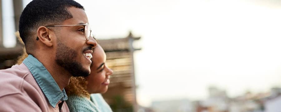 Happy couple spending time on rooftop.