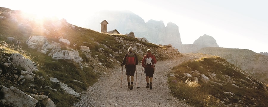 A couple of people hiking on a trail