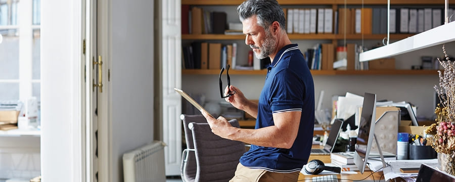 Man looking at papers in an office