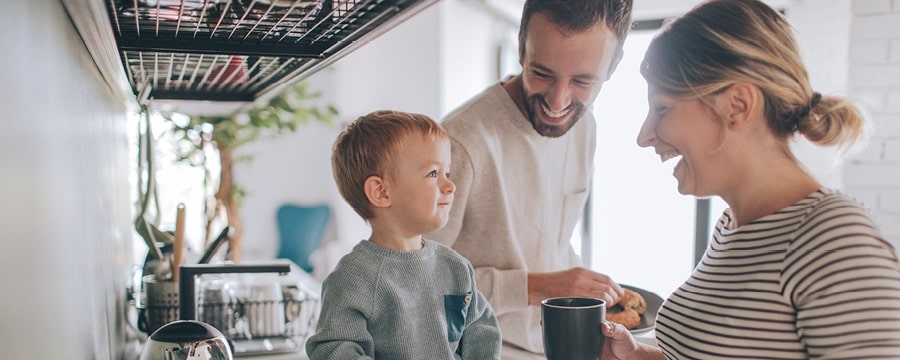 A person and child smiling at each other