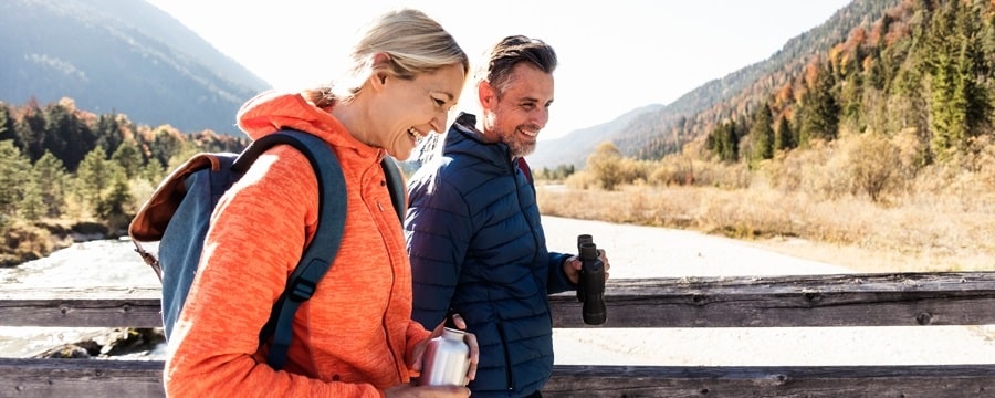 Man and woman hiking outside.