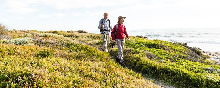 A person and person walking on a hill