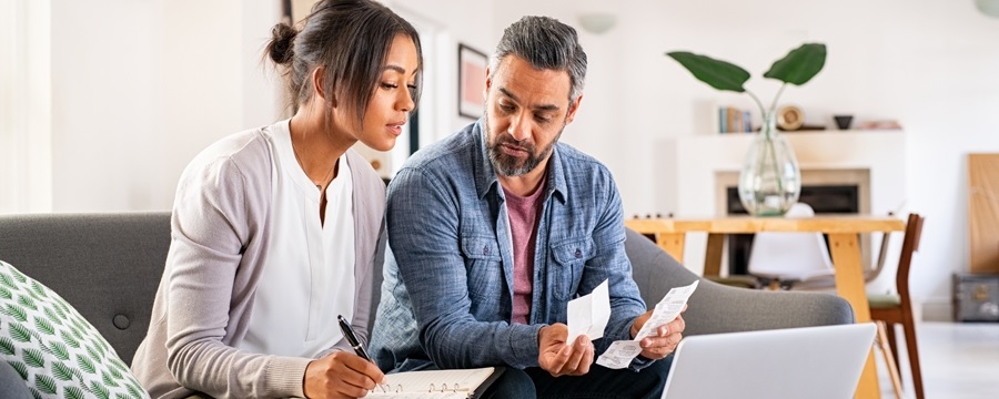 A person and person looking at papers