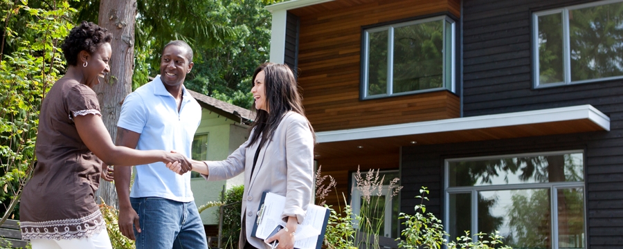 Couple meeting with real estate agent