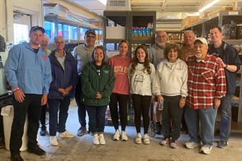 Our team, family members, and clients serving at the Worthington Resource Pantry in June 2023.