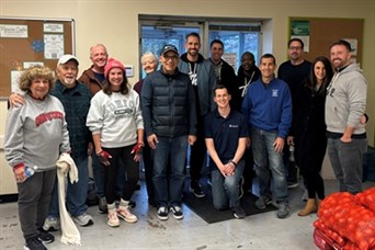 Our team, family members, and clients serving at the Worthington Resource Pantry in November 2023.