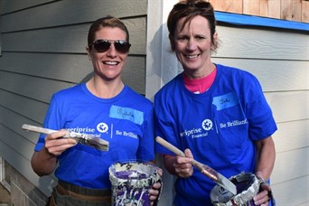 Michelle and Juli volunteering for Habitat for Humanity's "A Brush with Kindness" program.