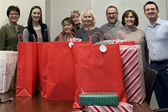 Coming together to support local communities and spread joy through the Adopt a Family program. 